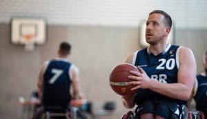 James MacSorley preparing to shoot basketball for Team GB wheelchair basketball